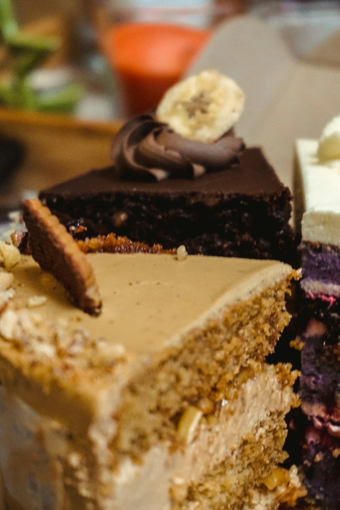 sliced chocolate cake with white cream on white ceramic plate