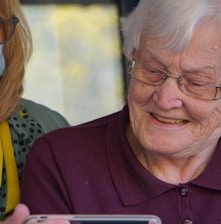 woman in purple polo shirt wearing eyeglasses