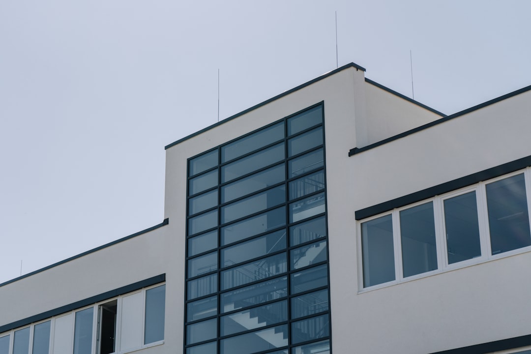 white concrete building under white sky during daytime