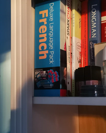 black and gray electronic device on white wooden shelf