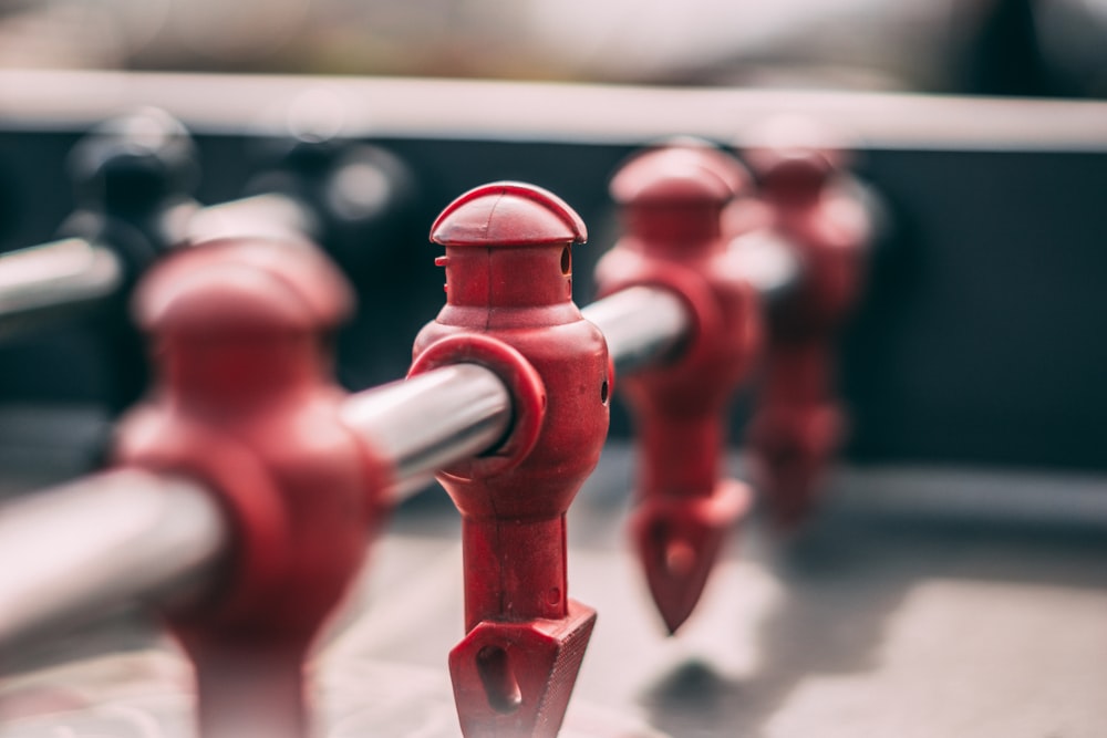 red metal pipe in close up photography