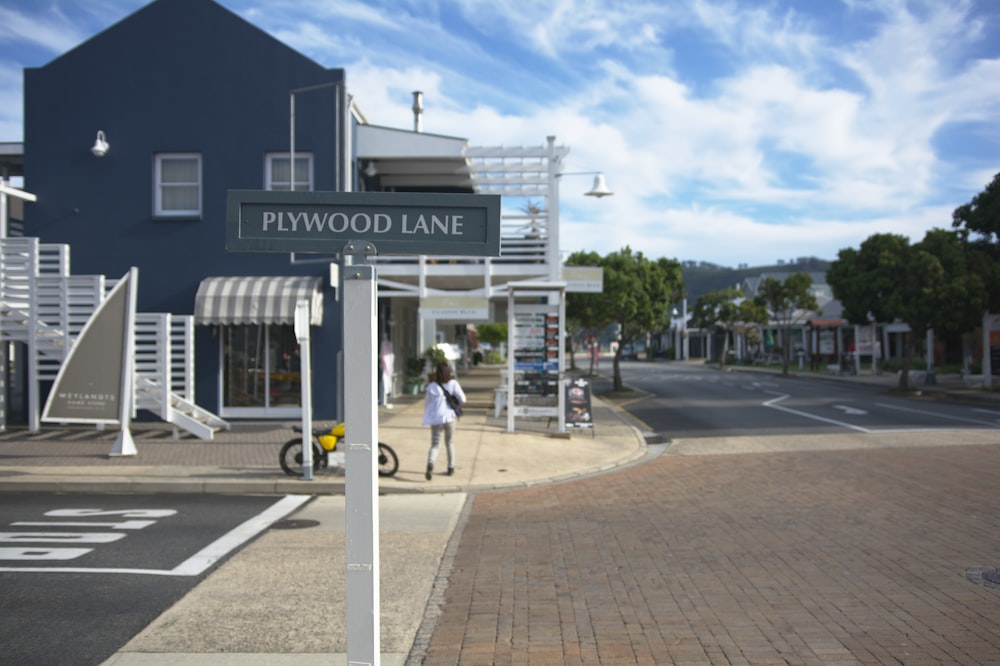 white and blue building near road during daytime