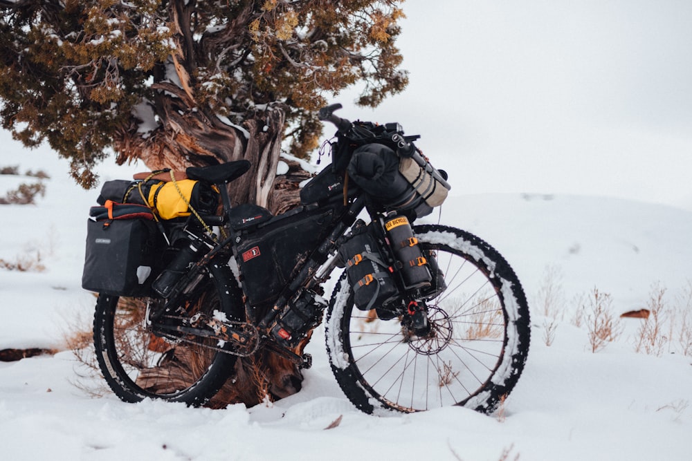 black and yellow motorcycle on snow covered ground