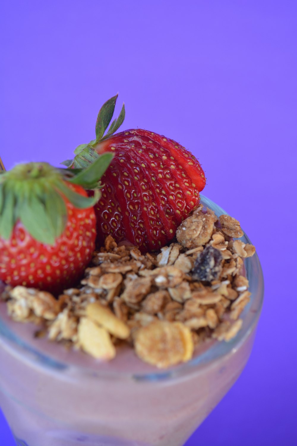 red strawberries on clear glass bowl