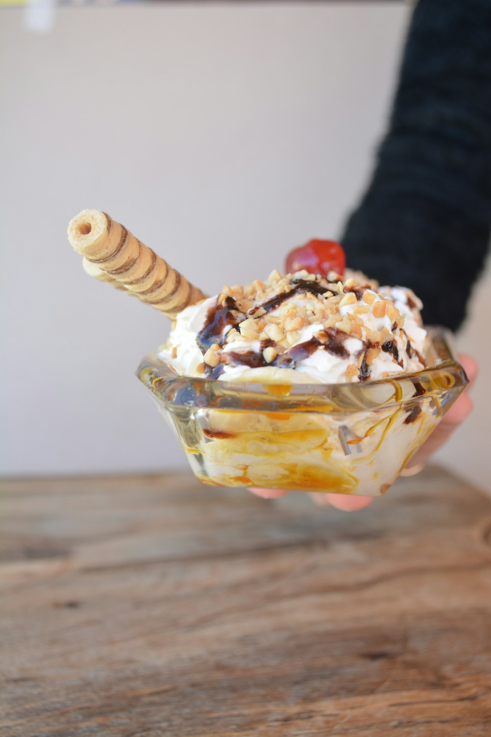 ice cream with cherry on clear glass cup