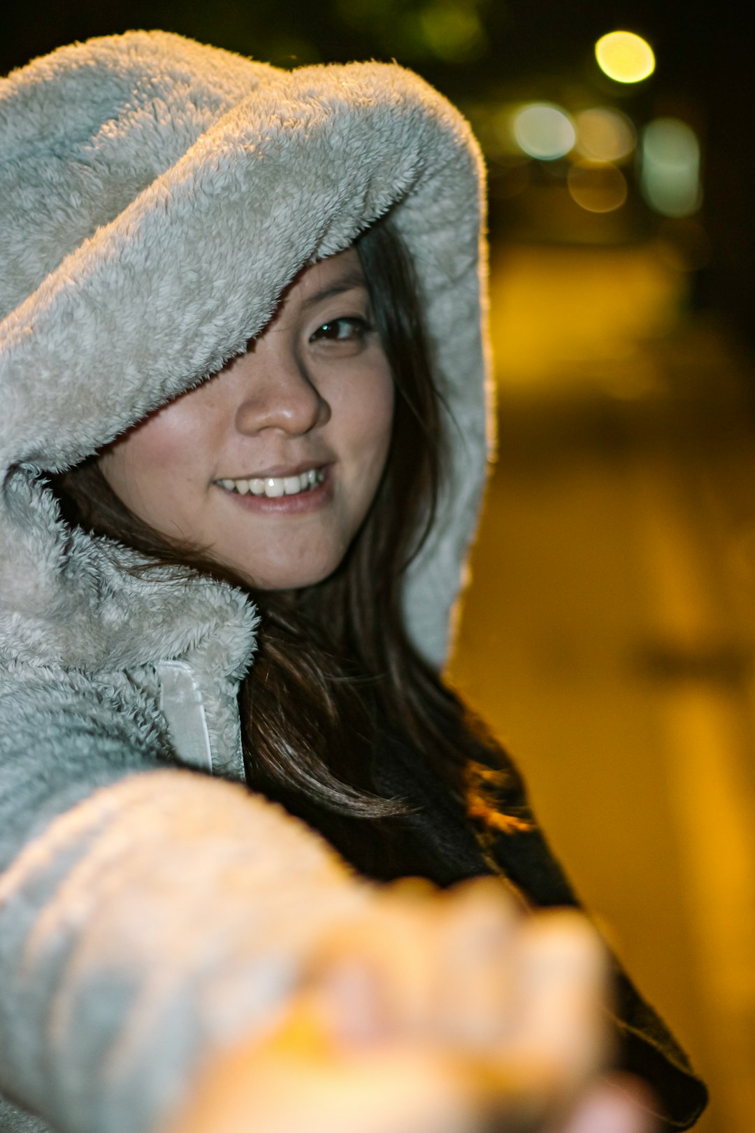 woman in gray fur hoodie