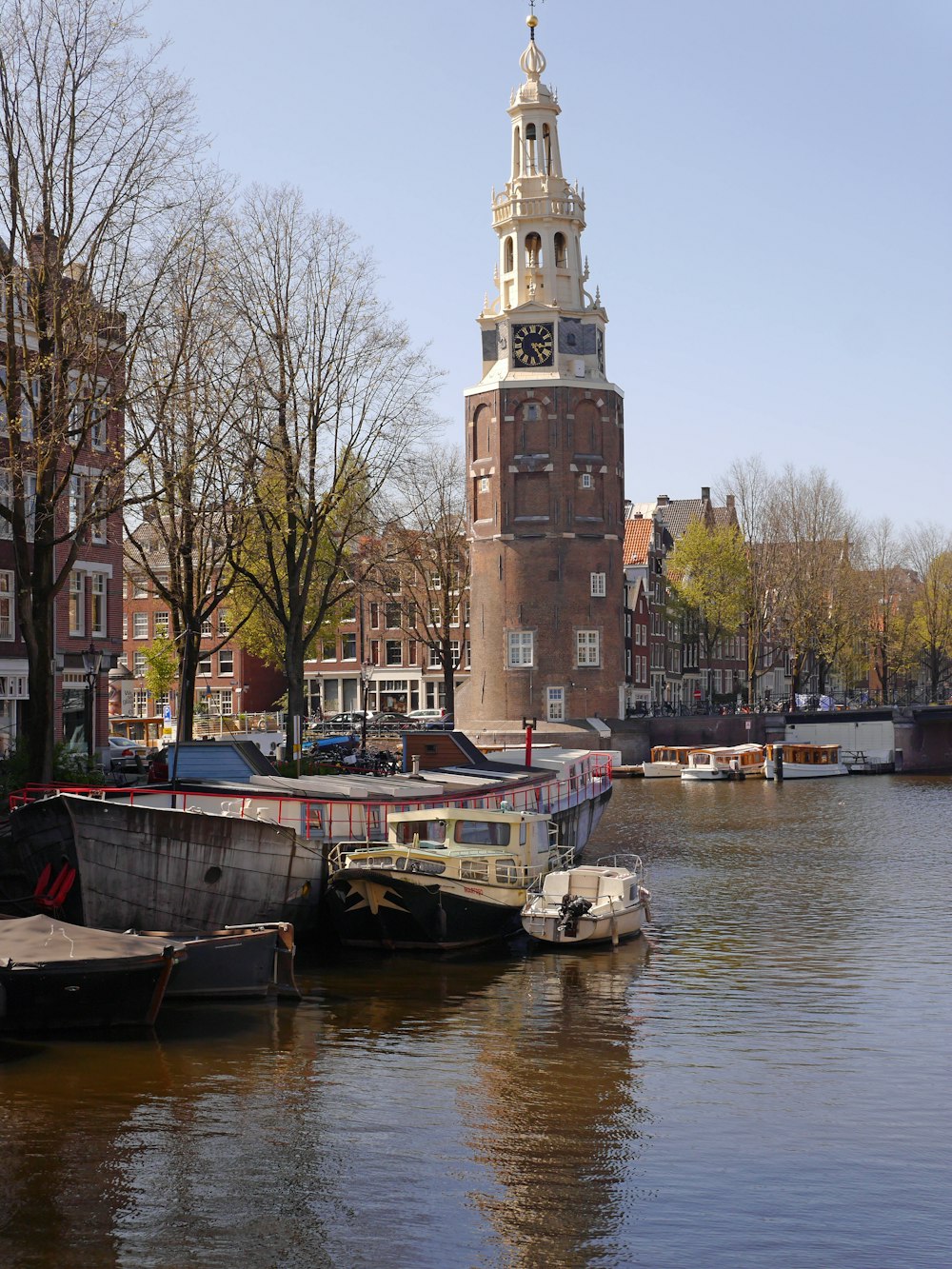 brown concrete building near body of water during daytime