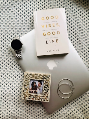 a laptop computer sitting on top of a table