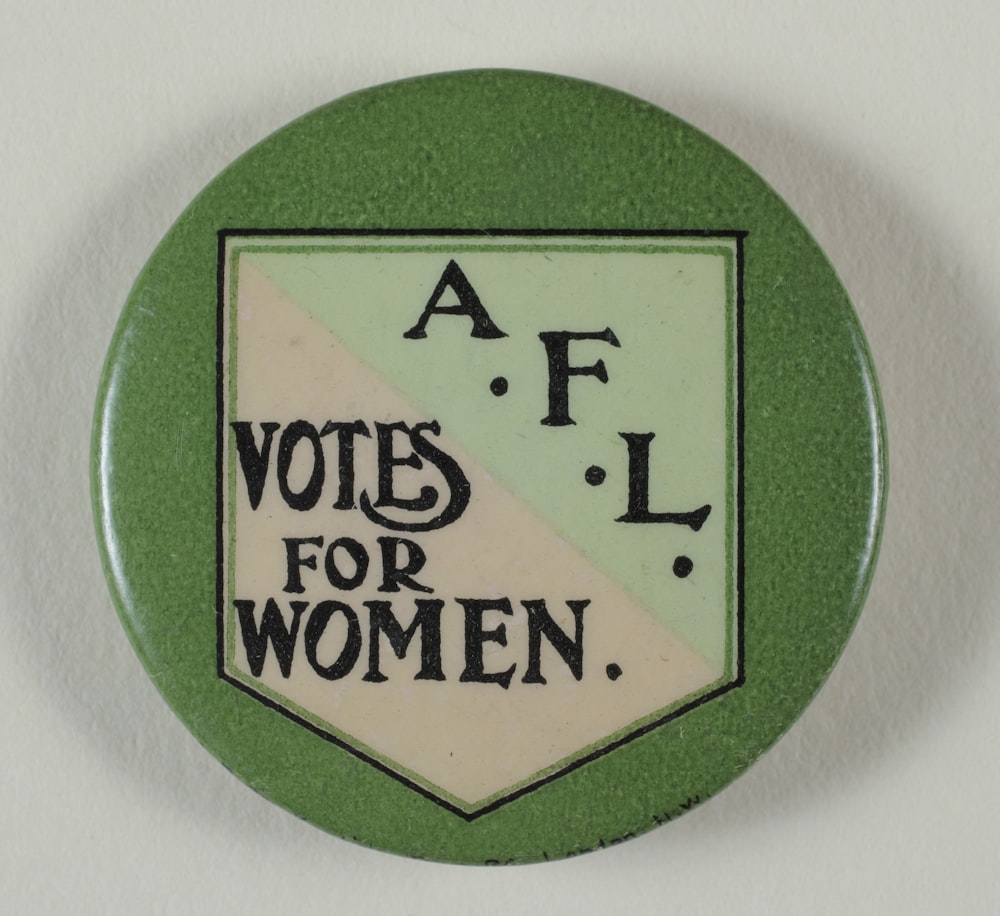 a button with the words a f vote for women on it
