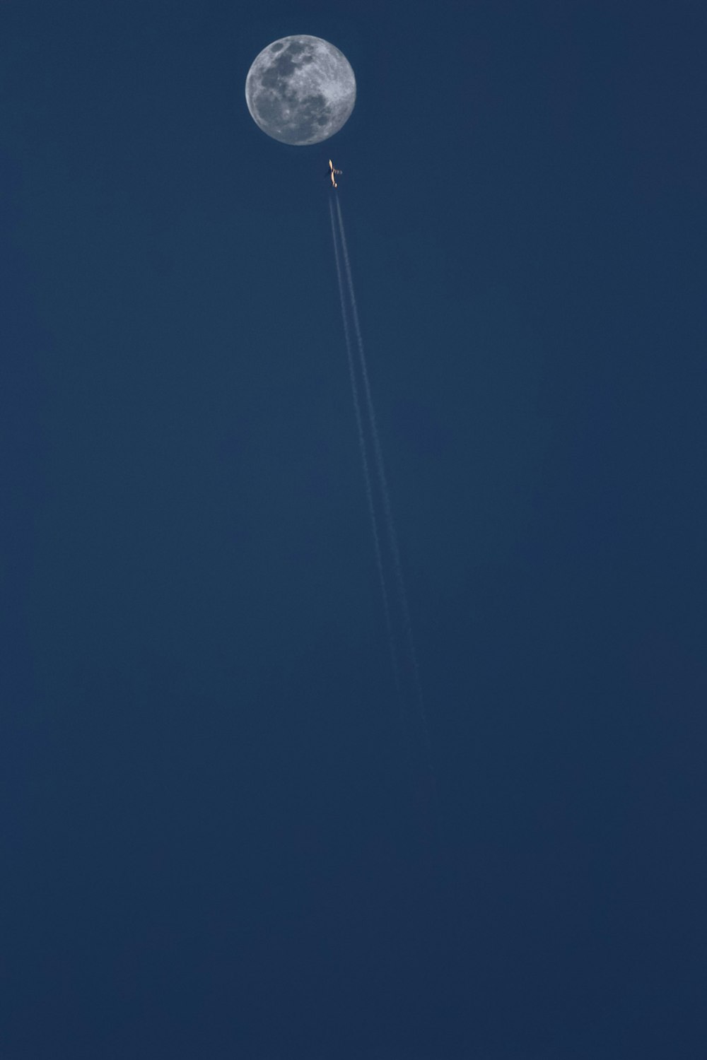 white string light under blue sky