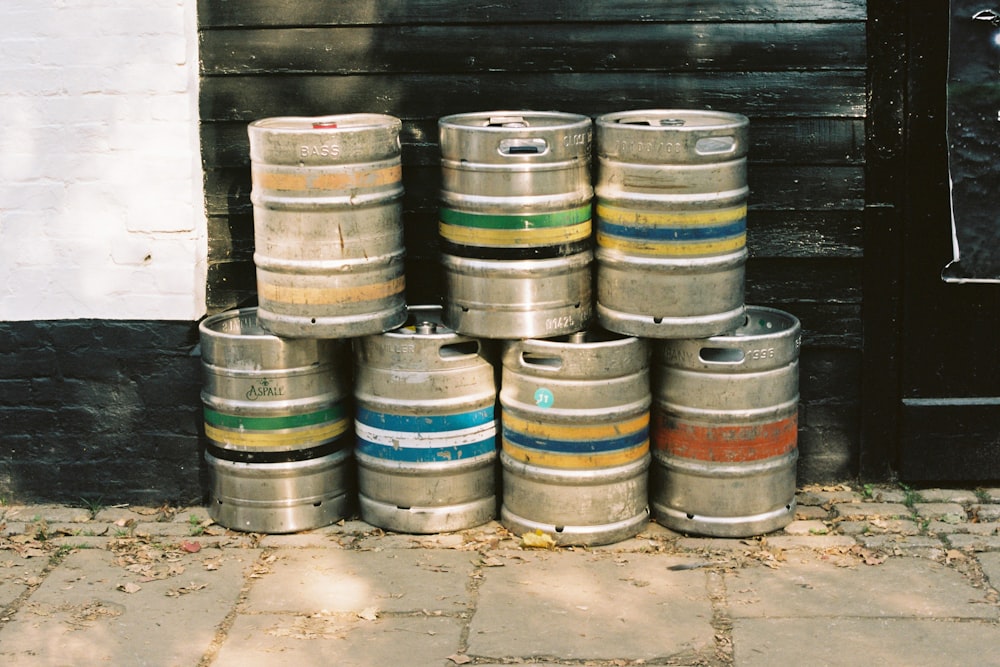 brown wooden barrels on gray concrete floor