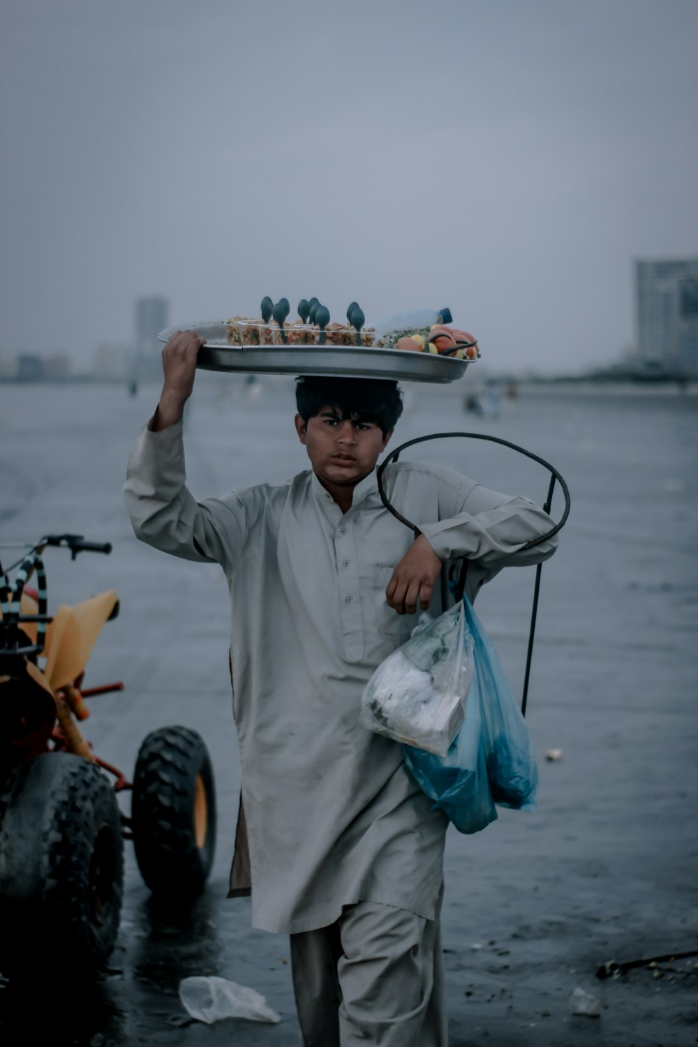 man in white long sleeve shirt and white hat holding white plastic bag