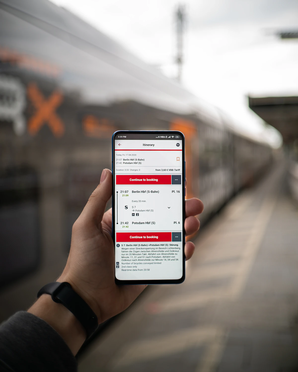 Person searching for travel options on a smartphone