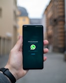 person holding black android smartphone