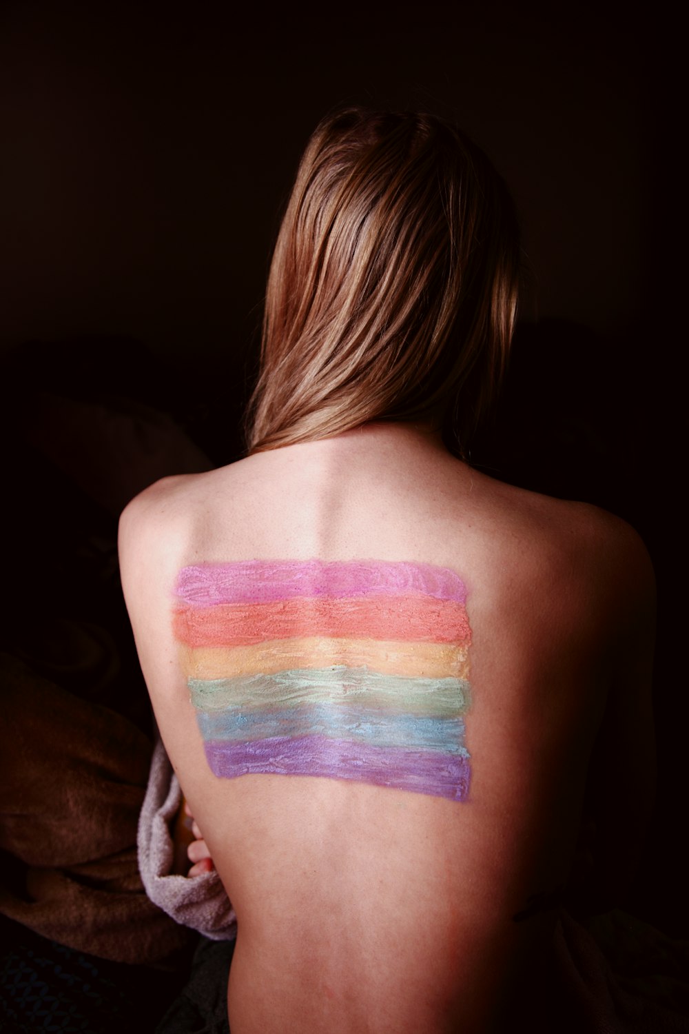 woman with blue and purple paint on her body