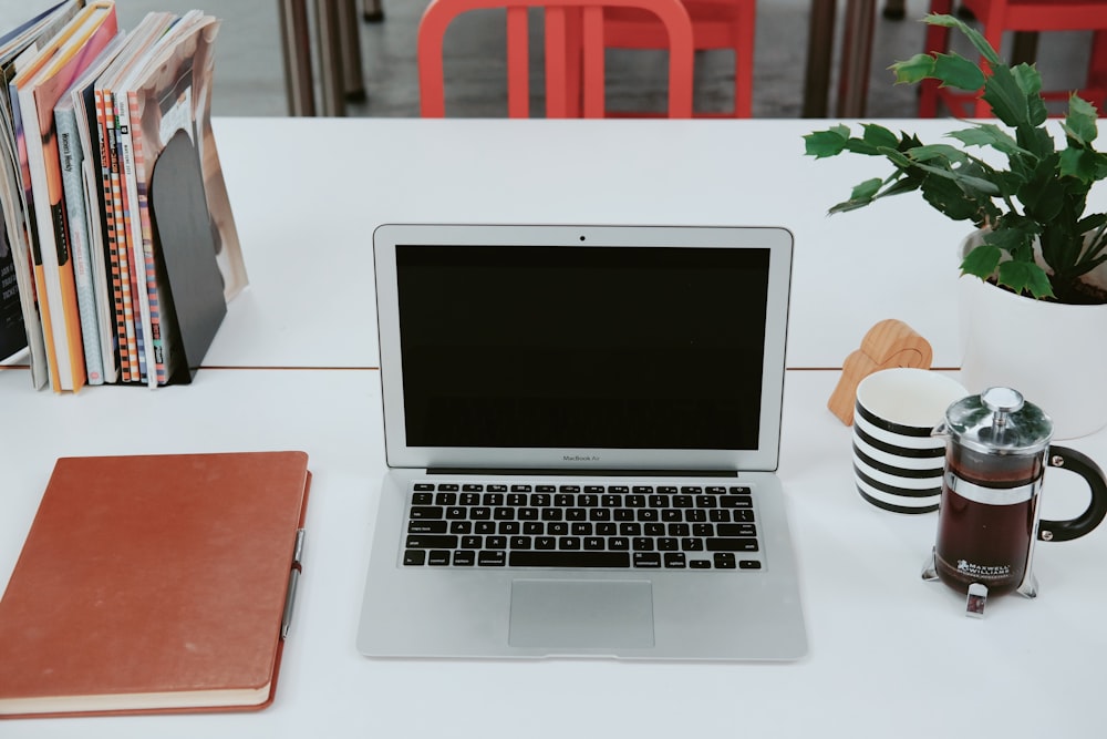 macbook air on white table