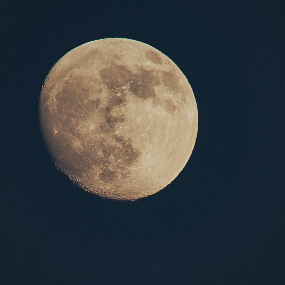 full moon in dark night sky