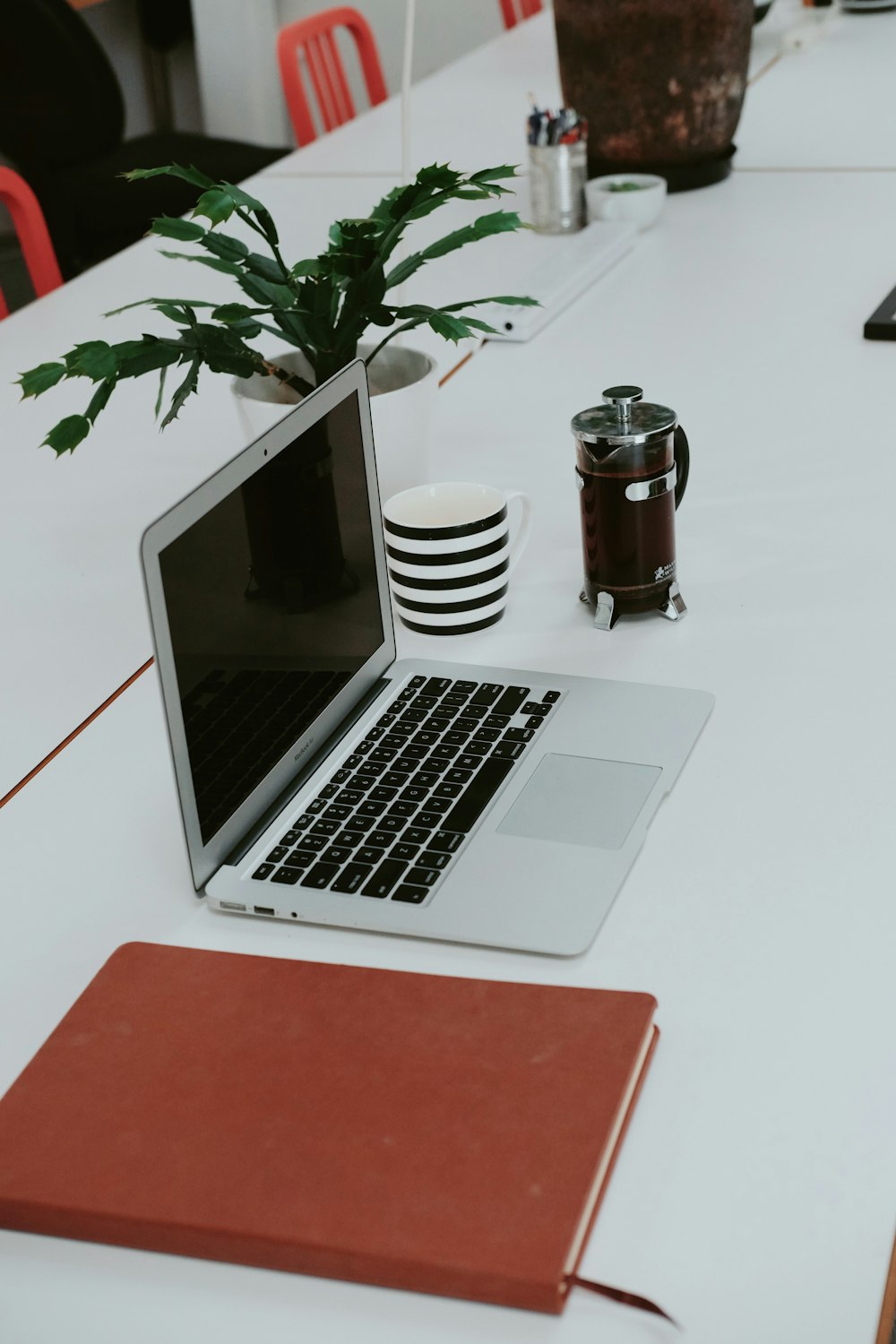 macbook pro on white table