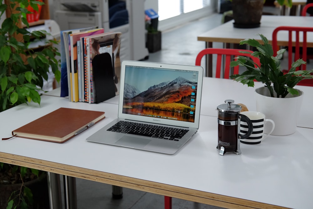 macbook pro on white table