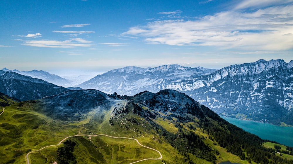 green and white mountains under blue sky during daytime