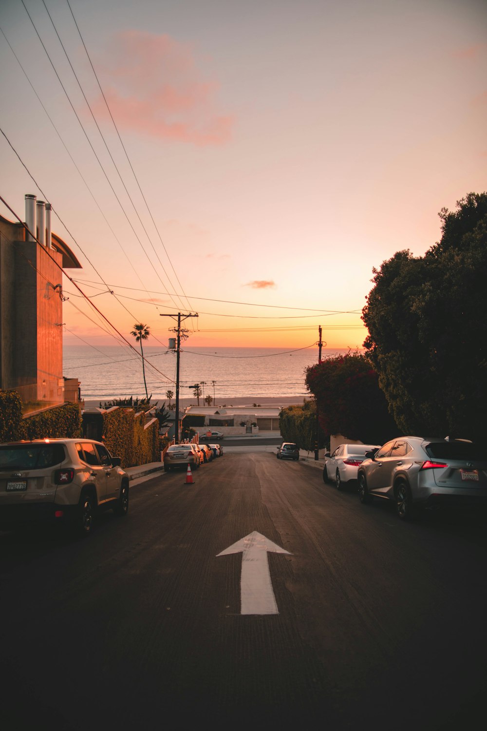 cars parked on parking lot during sunset