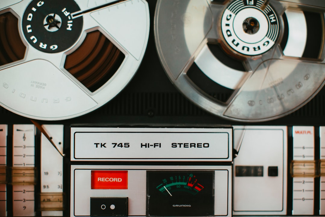 a close up of two reels on a machine, German sound engineering – magnetic tape recorder music system – TK 745 HI-FI STEREO – Year: 1975