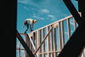 construction worker in hard hat on building frame