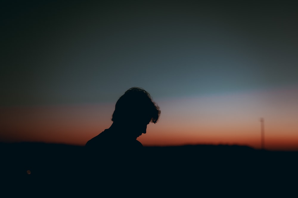 silhouette of man during sunset