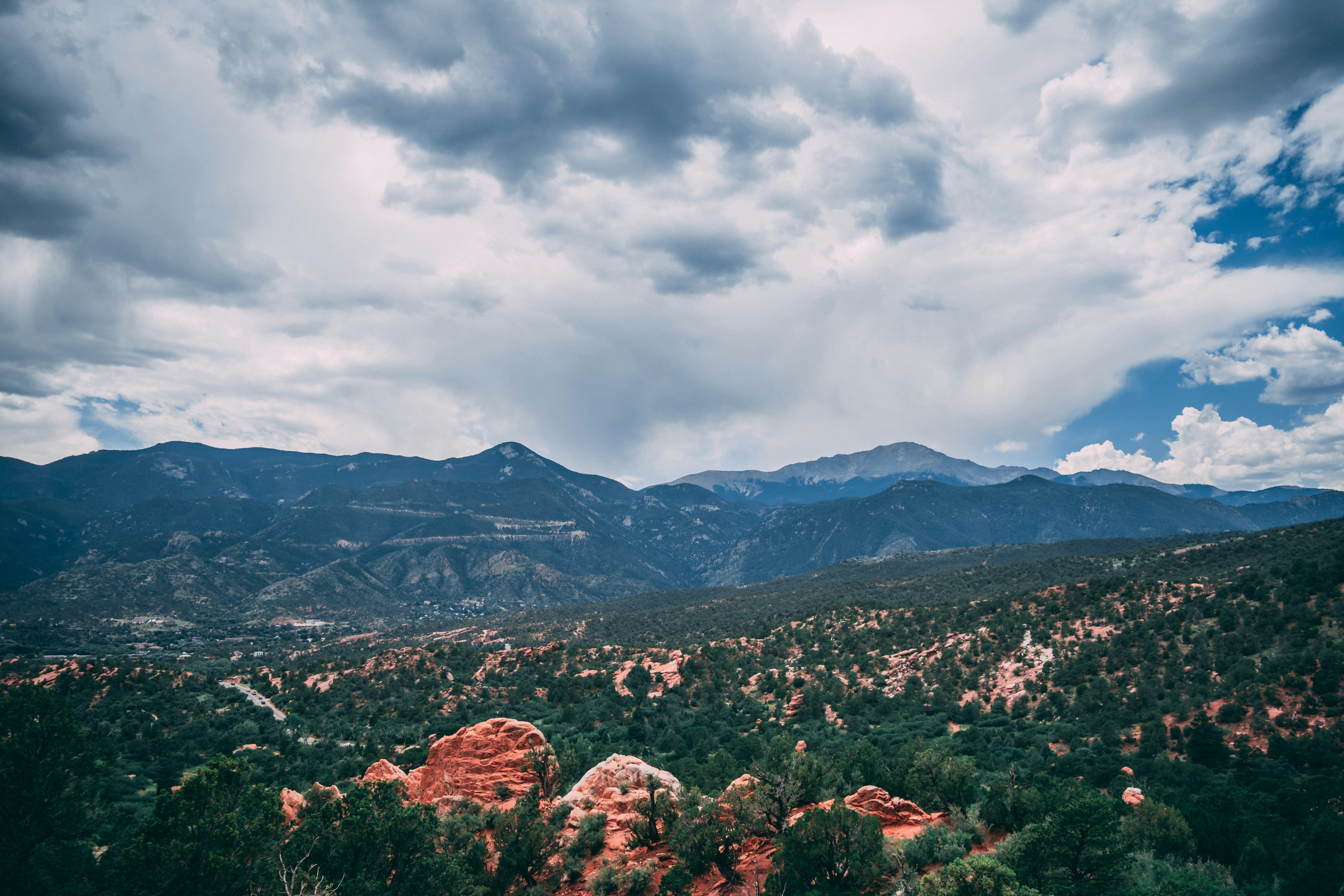aerial view of city under cloudy sky during daytime