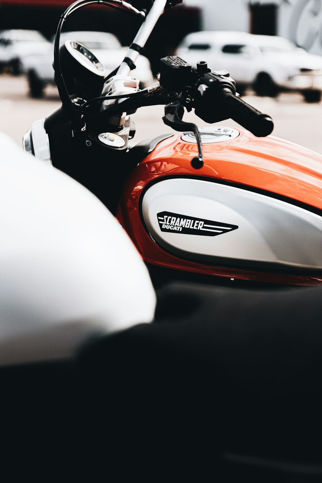 red and black motorcycle in close up photography