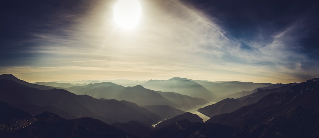 mountains under white clouds during daytime