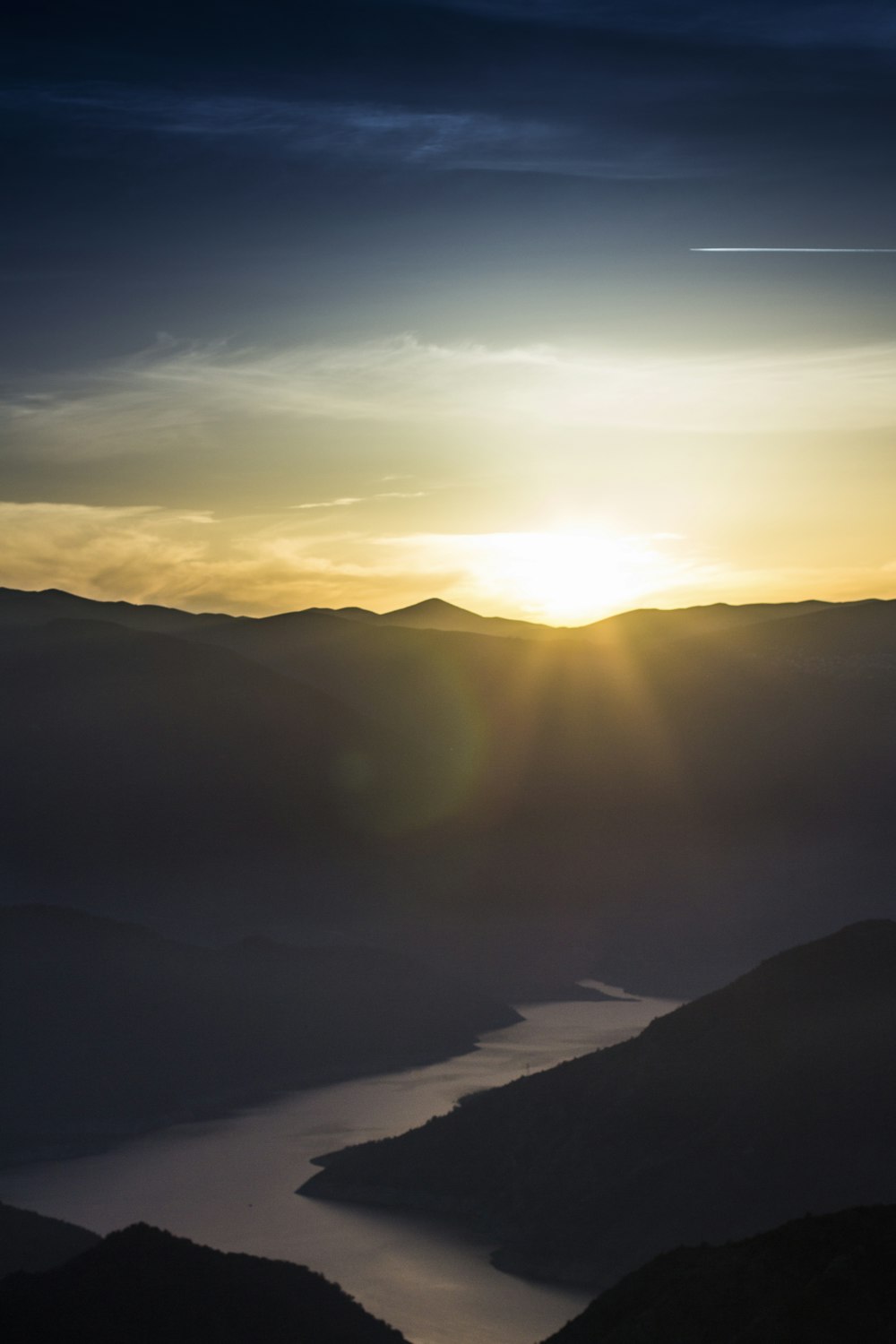 silhouette of mountains during sunset