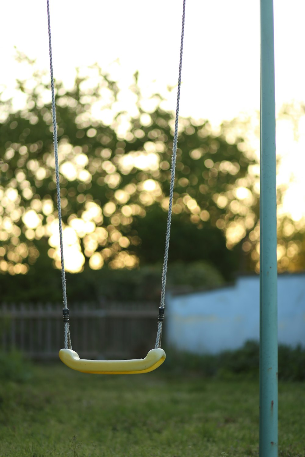 yellow and black swing chair