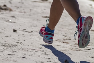 person wearing blue and white sneakers