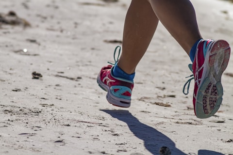 person wearing blue and white sneakers