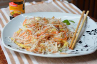 Freshly prepared Chinese vegetarian noodles served steaming hot.