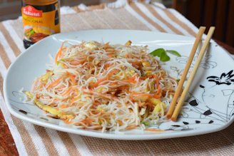 Freshly prepared Chinese vegetarian noodles served steaming hot.