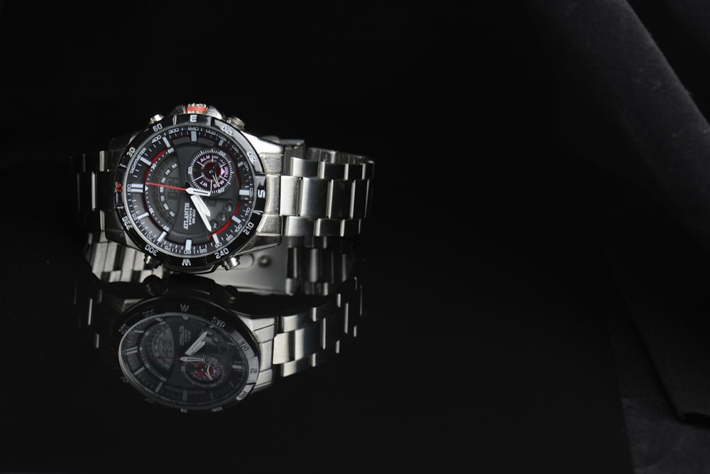 silver and black chronograph watch