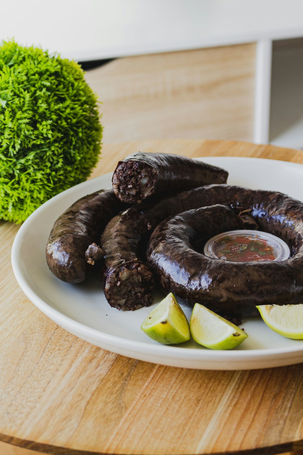 brown cooked food on white ceramic plate