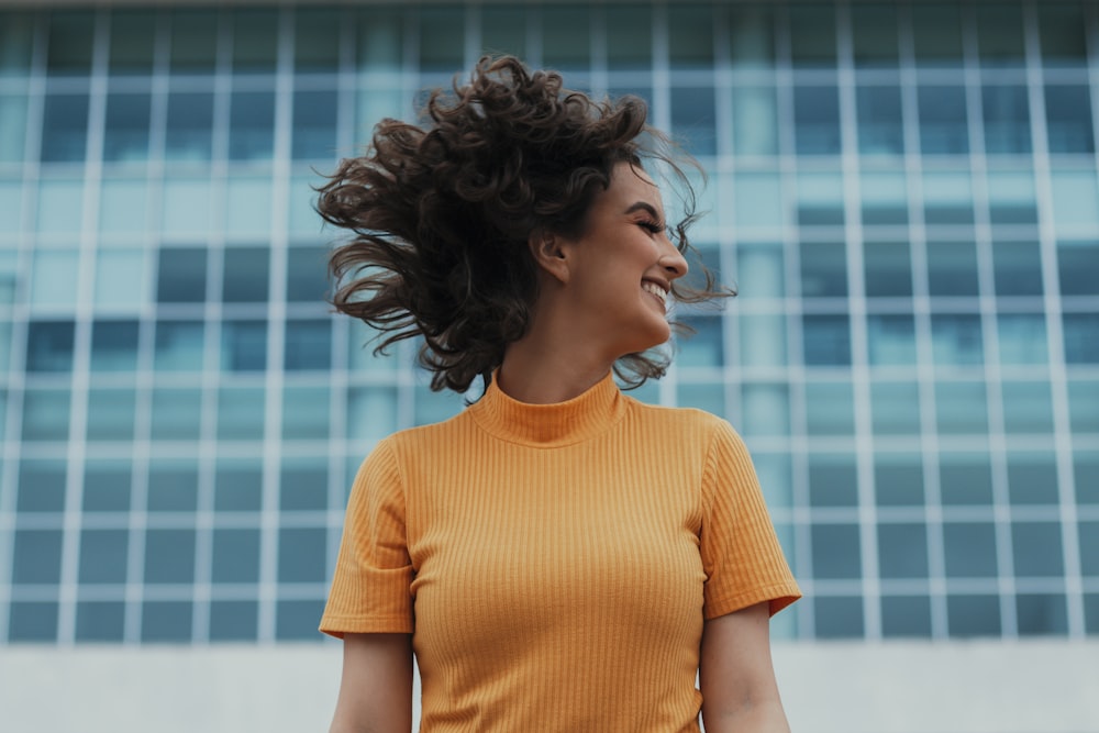 woman in orange crew neck t-shirt