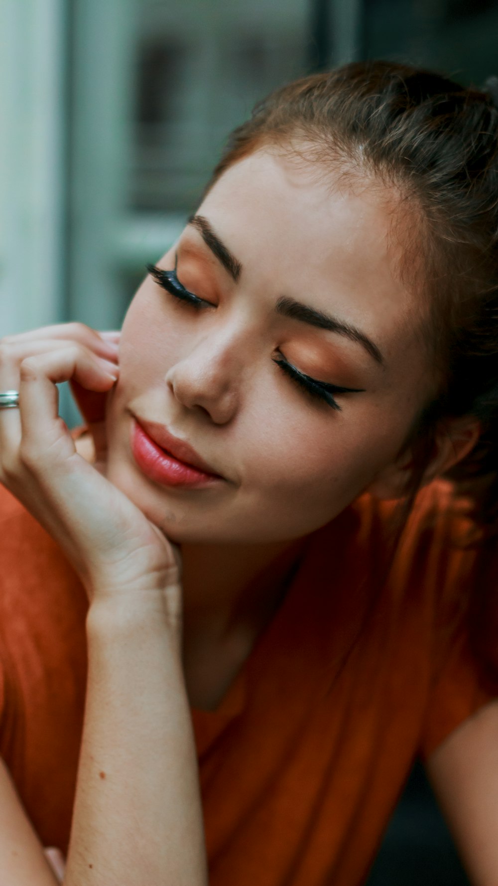 woman in red shirt with blue eyes