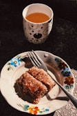 An inviting cup of herbal tea next to a diabetes-friendly dessert.