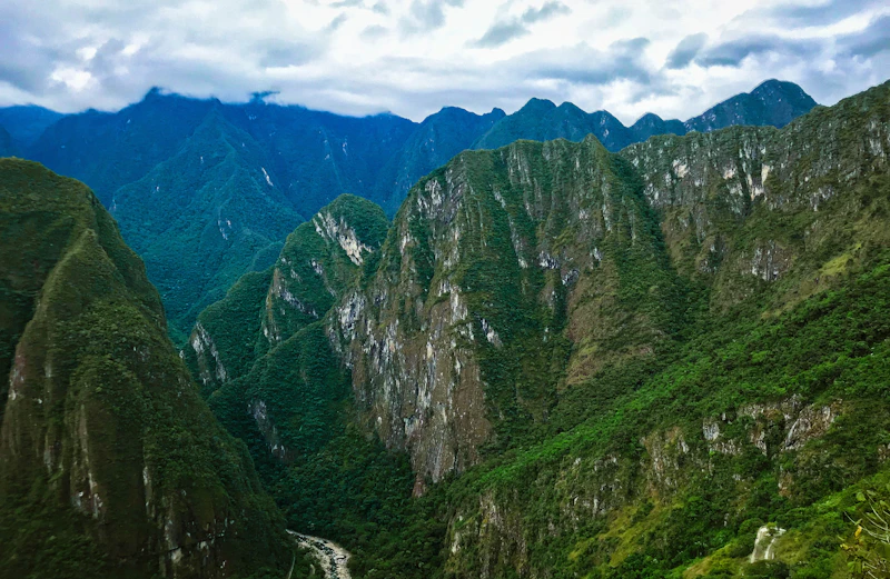 The river valley winding below the green peaks around Machu Picchu in the Cusco region