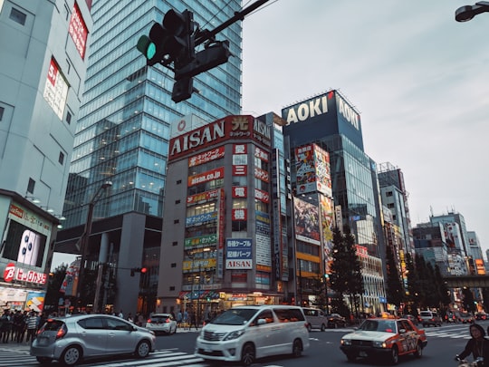 cars on road in city during daytime in Carl's Jr. Akihabara Japan