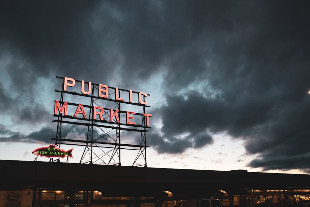 a public market sign on top of a building