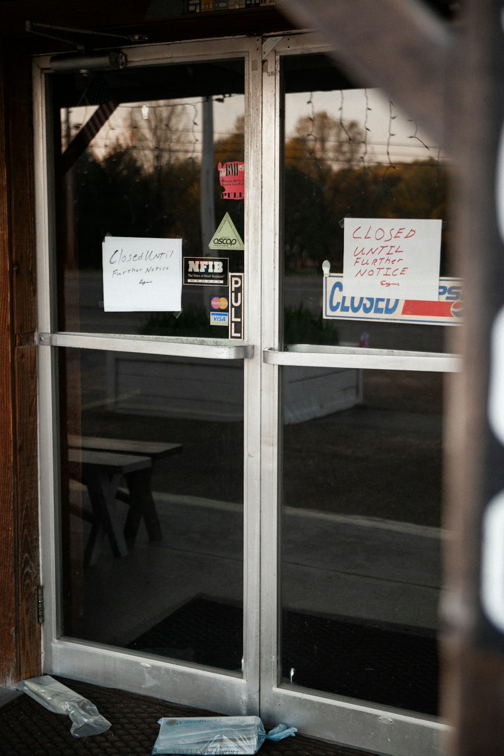 white and red signage on glass window