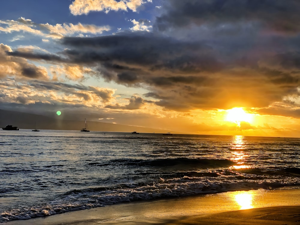 body of water during sunset