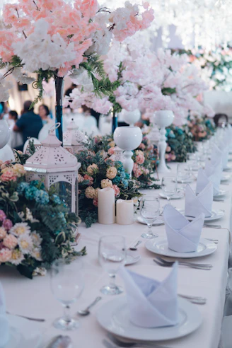 white and pink flowers on white ceramic vase
