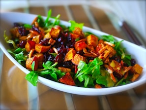 A vibrant salad bowl with mixed greens, cherry tomatoes, and crunchy croutons