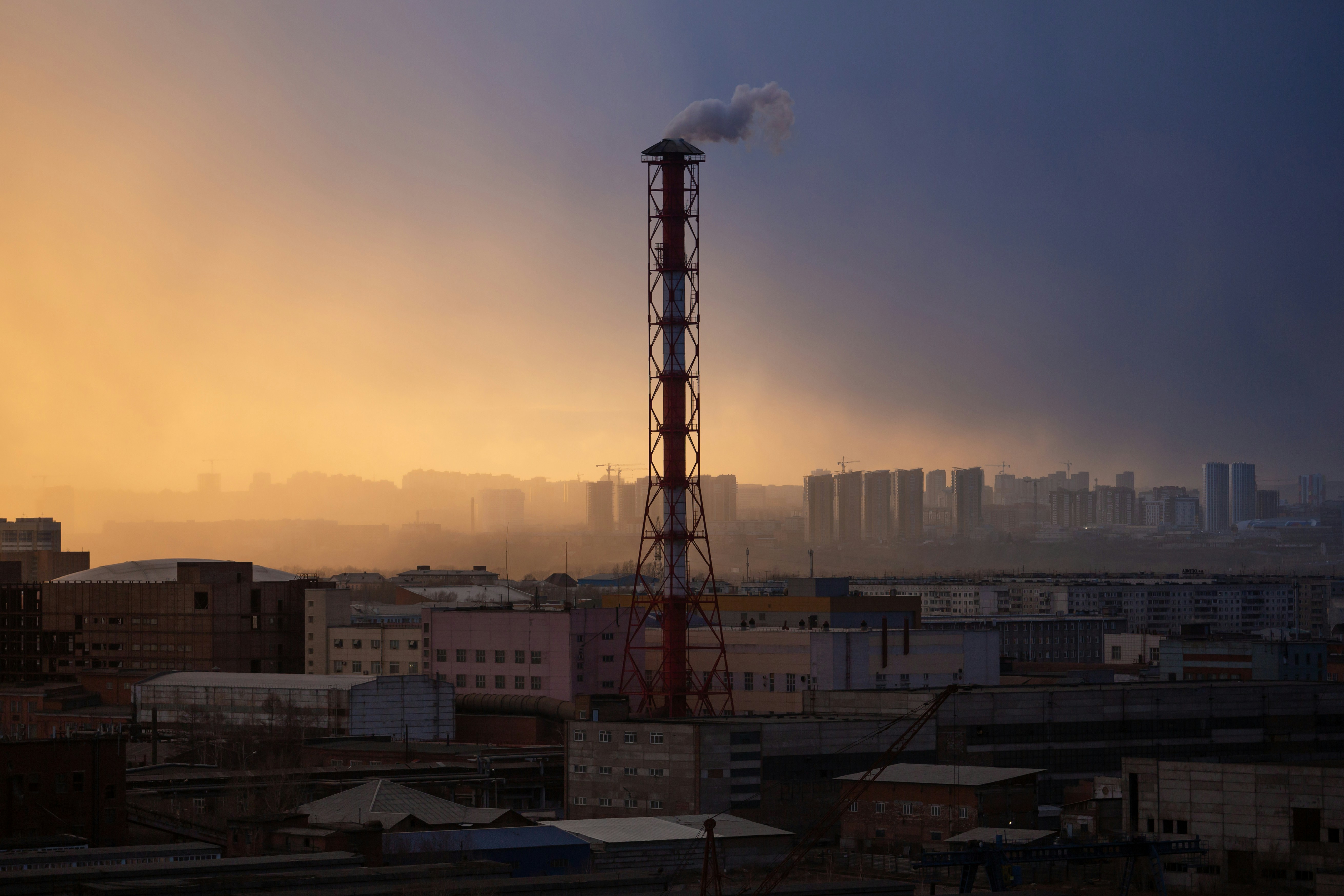 red tower near white concrete building during daytime